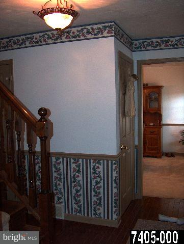 2760 Stoverstown Road, Unit 5 Spring Grove, PA 17362 - Photo 5 of 9 a view of a hallway with wooden floor