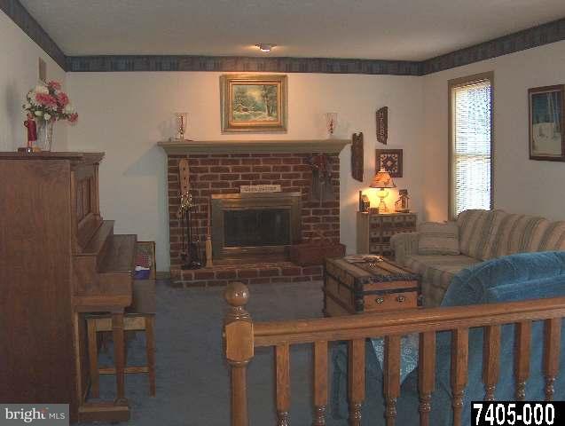 2760 Stoverstown Road, Unit 5 Spring Grove, PA 17362 - Photo 9 of 9 a living room with furniture and a fireplace