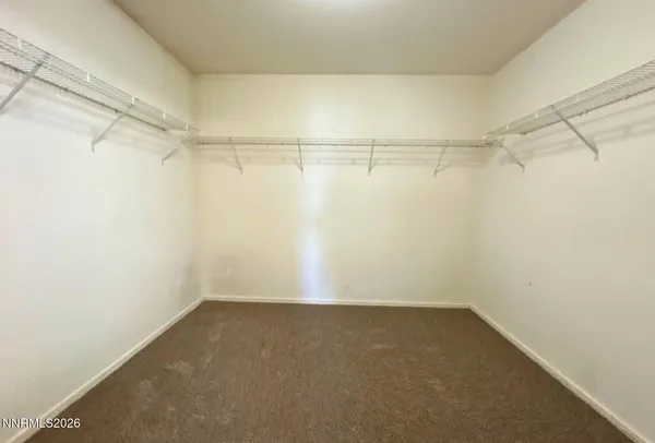 a view of a room with shelf on the wall