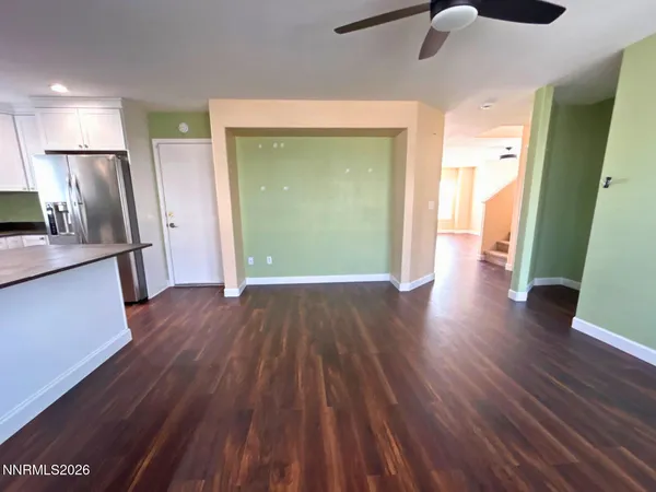 a view of a kitchen from a hallway
