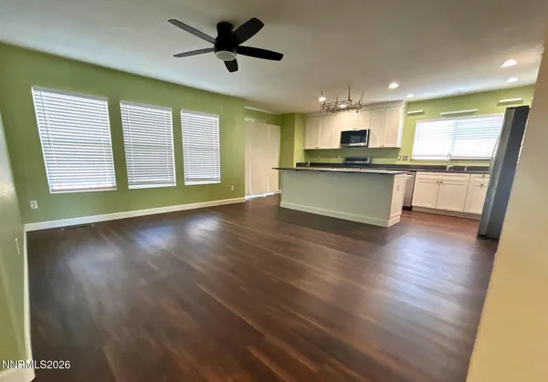 a view of kitchen with cabinets and wooden floor