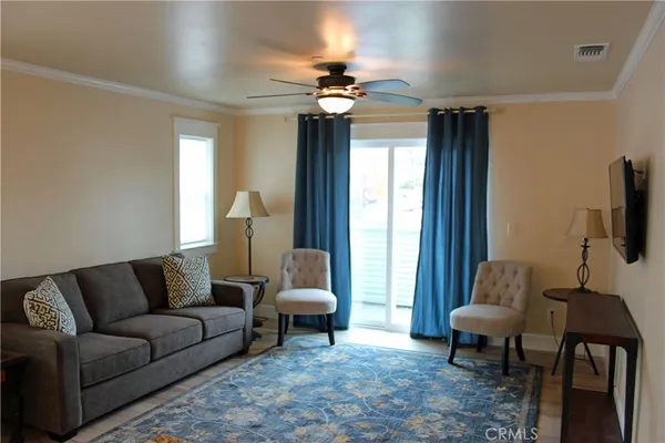 a living room with furniture and a window