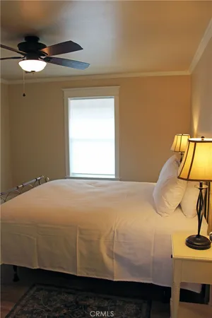 a bedroom with a bed and window