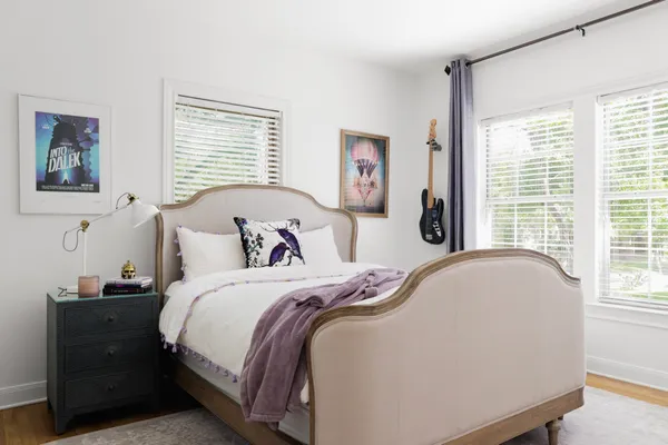 a bedroom with bed and a window