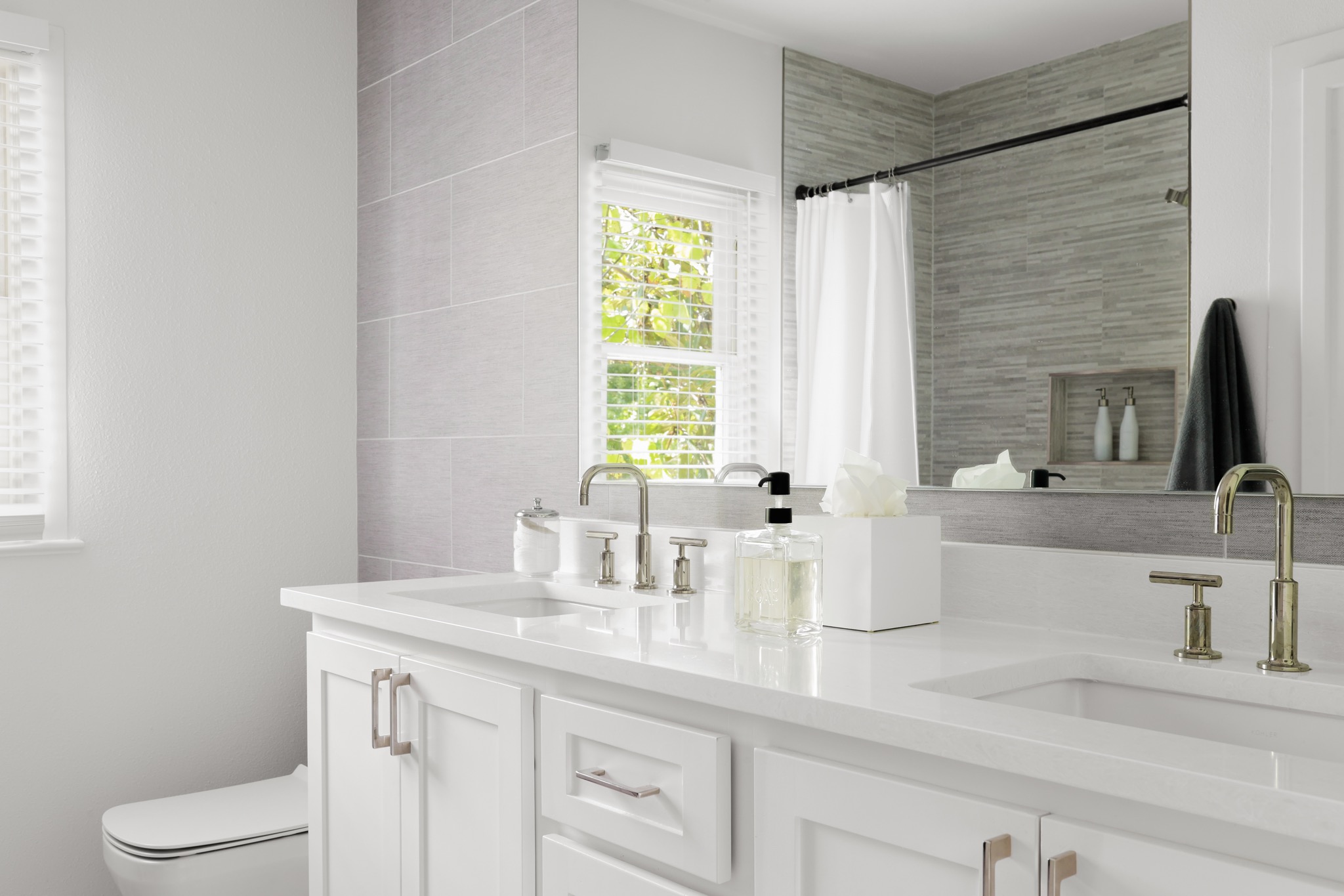 2803 Bridle Path Austin, TX 78703 - Photo 15 of 21 Full bathroom with double vanity and a shower with shower curtain