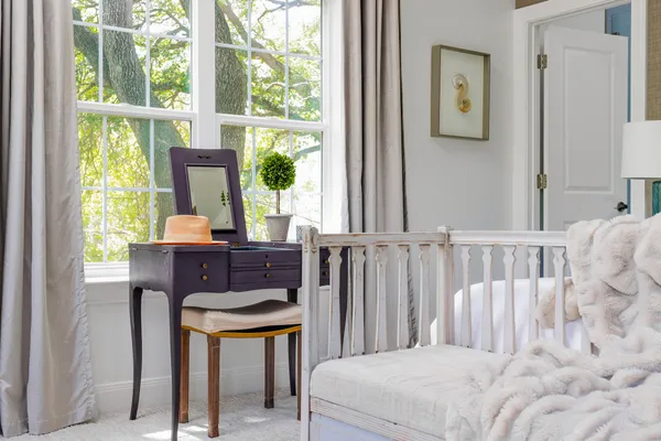 a bedroom with furniture and a window