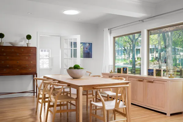 a dining room with furniture and window