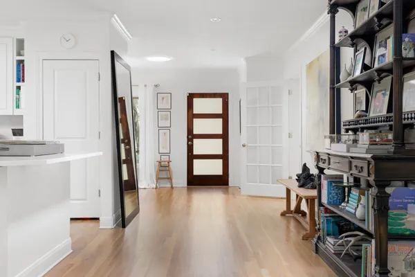 a view of a livingroom with furniture and an empty room