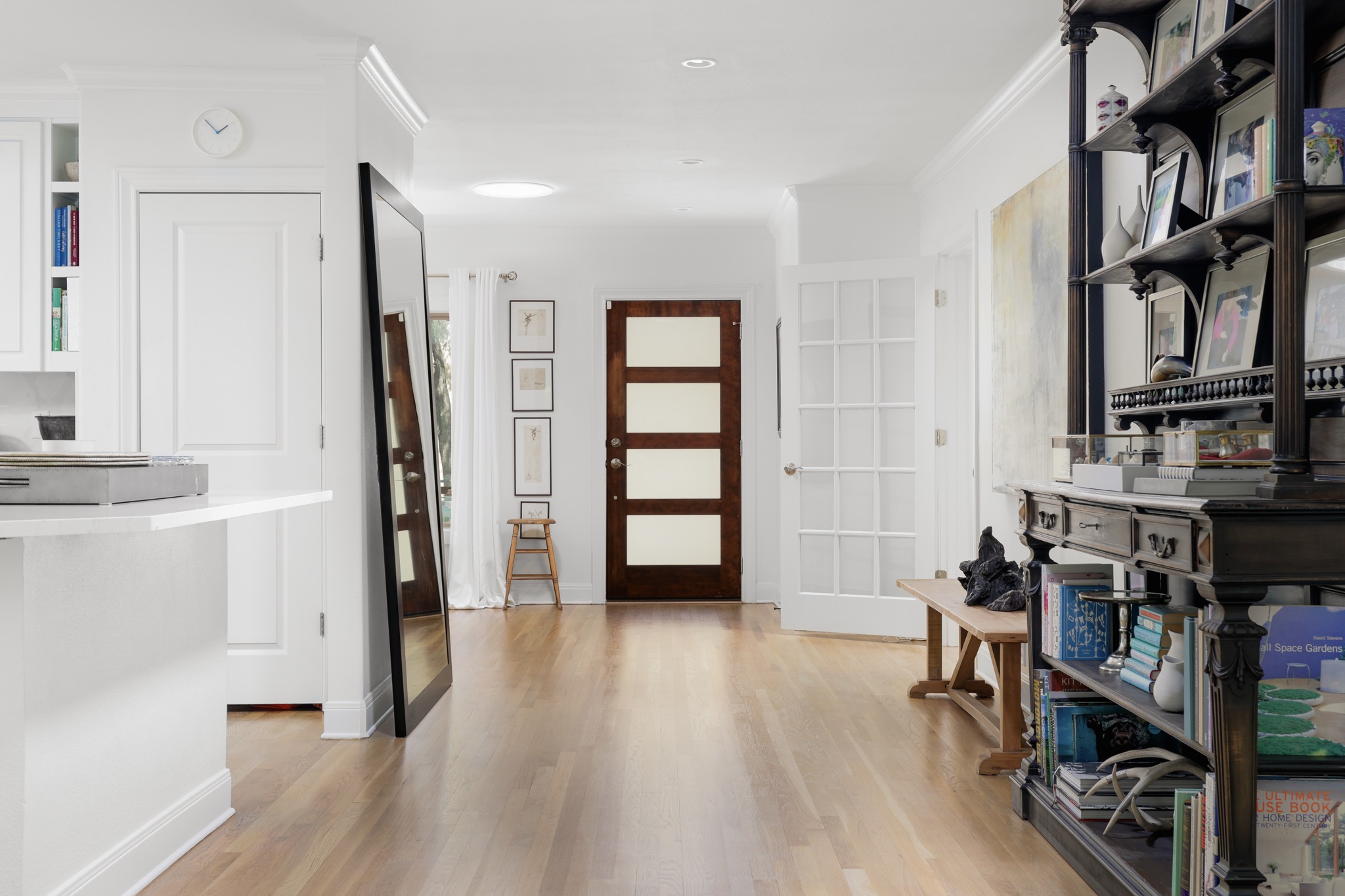 2803 Bridle Path Austin, TX 78703 - Photo 6 of 21 Entryway featuring light wood finished floors and ornamental molding