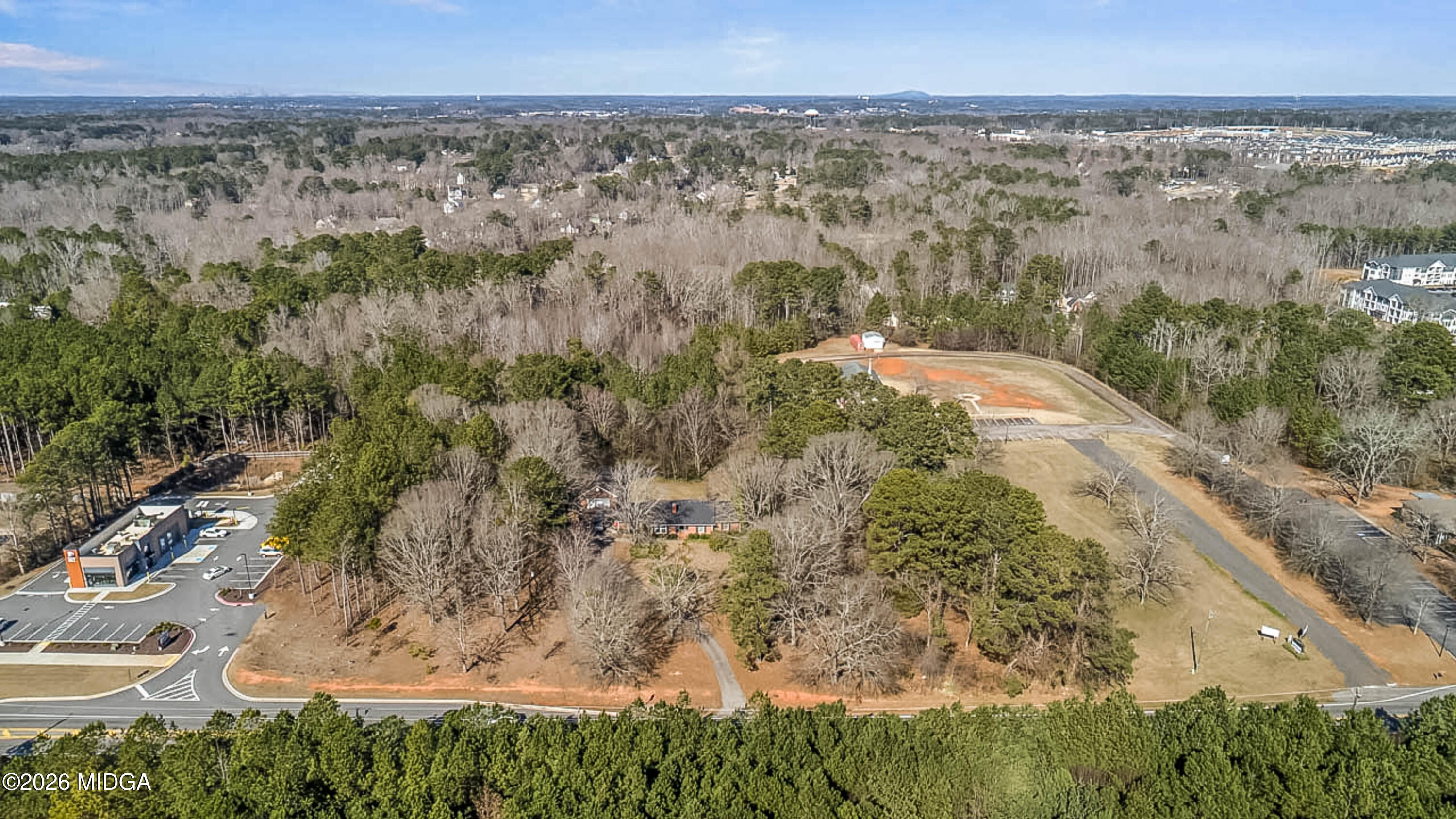 2226 Jonesboro Road McDonough, GA 30253 - Photo 6 of 8 a view of a yard with a forest
