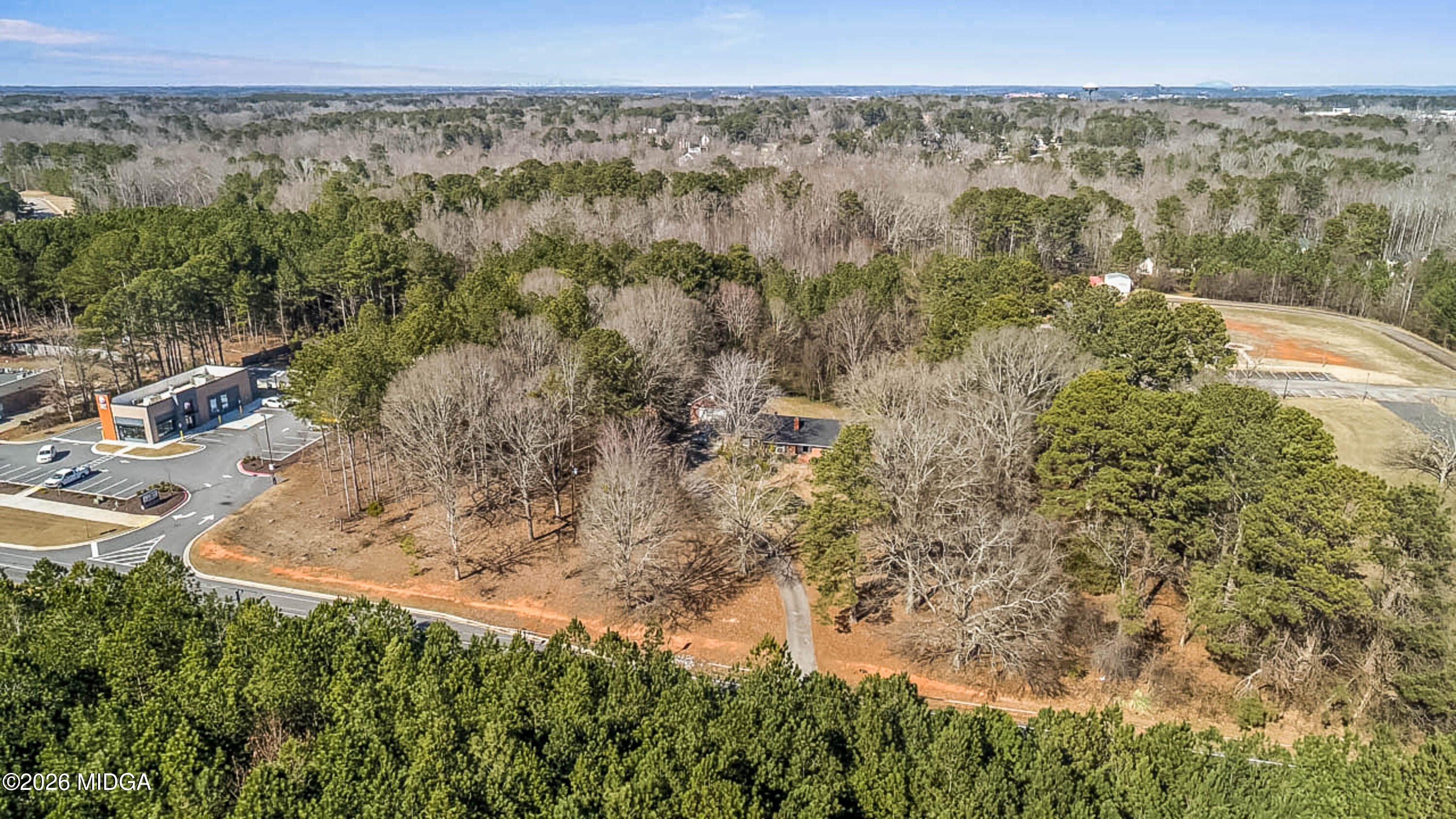 2226 Jonesboro Road McDonough, GA 30253 - Photo 7 of 8 a view of a yard with wooden fence