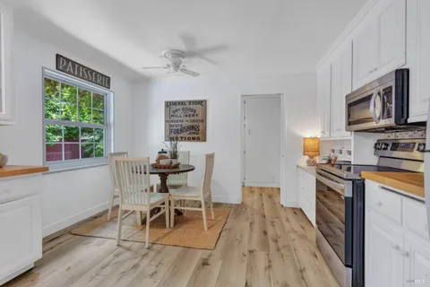 a dining room with furniture and window