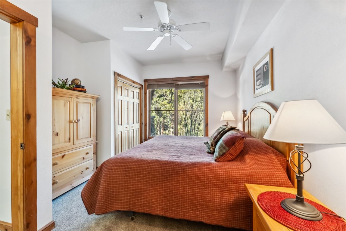 17 Lake Ridge Circle, Unit 1826 Keystone, CO 80435 - Photo 18 of 28 Carpeted bedroom with a closet and ceiling fan
