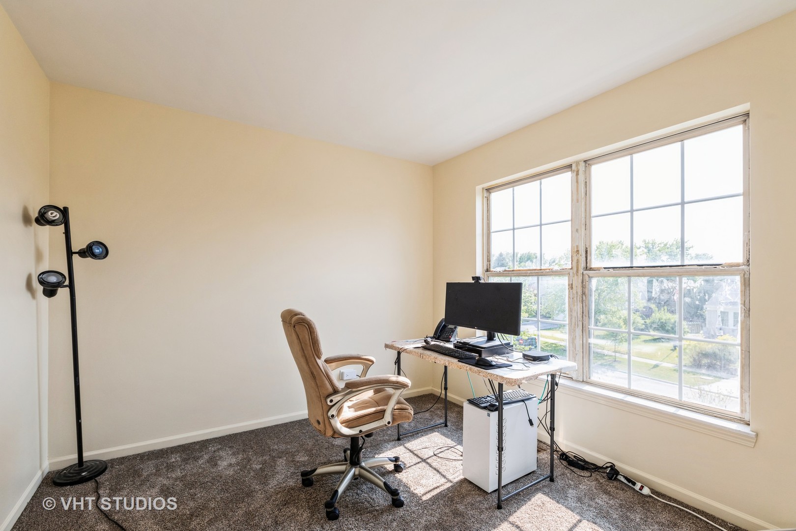 28494 Wagon Trail Road Lakemoor, IL 60051 - Photo 12 of 17 a view of a workspace with furniture and a window