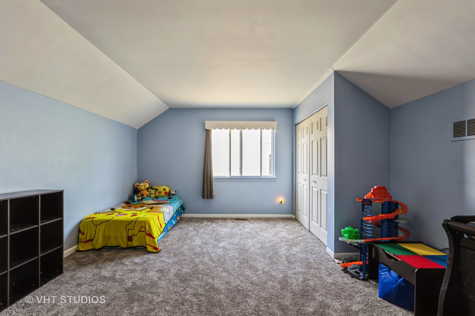 28494 Wagon Trail Road Lakemoor, IL 60051 - Photo 13 of 17 a bedroom with a bed and a window