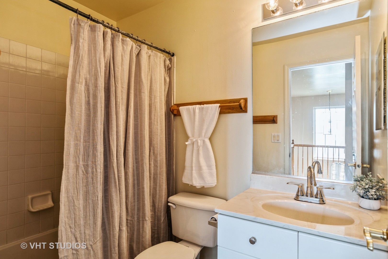 28494 Wagon Trail Road Lakemoor, IL 60051 - Photo 14 of 17 a bathroom with a sink a mirror and a toilet