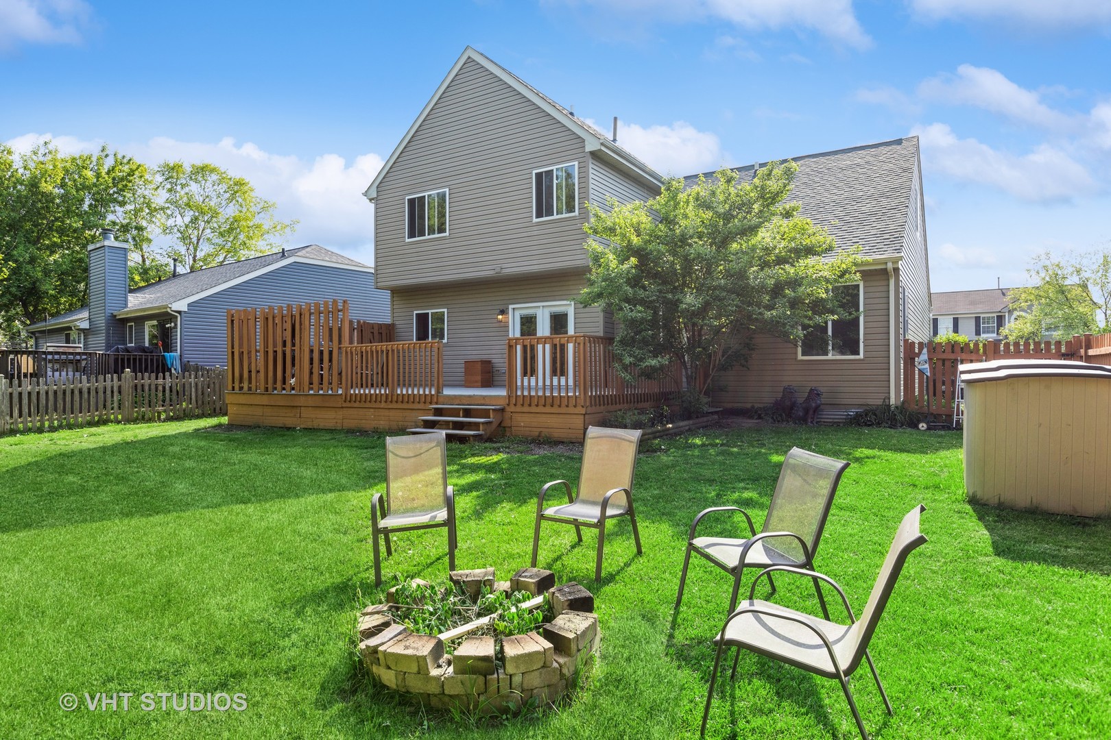28494 Wagon Trail Road Lakemoor, IL 60051 - Photo 16 of 17 a backyard of a house with seating space