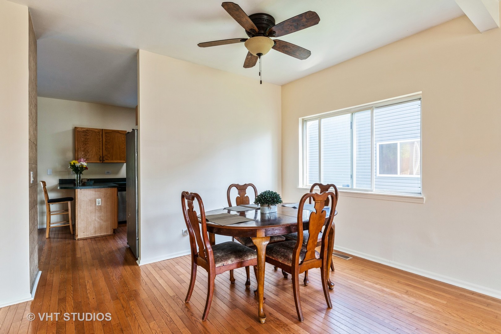 28494 Wagon Trail Road Lakemoor, IL 60051 - Photo 5 of 17 a view of a dining room with furniture and a window