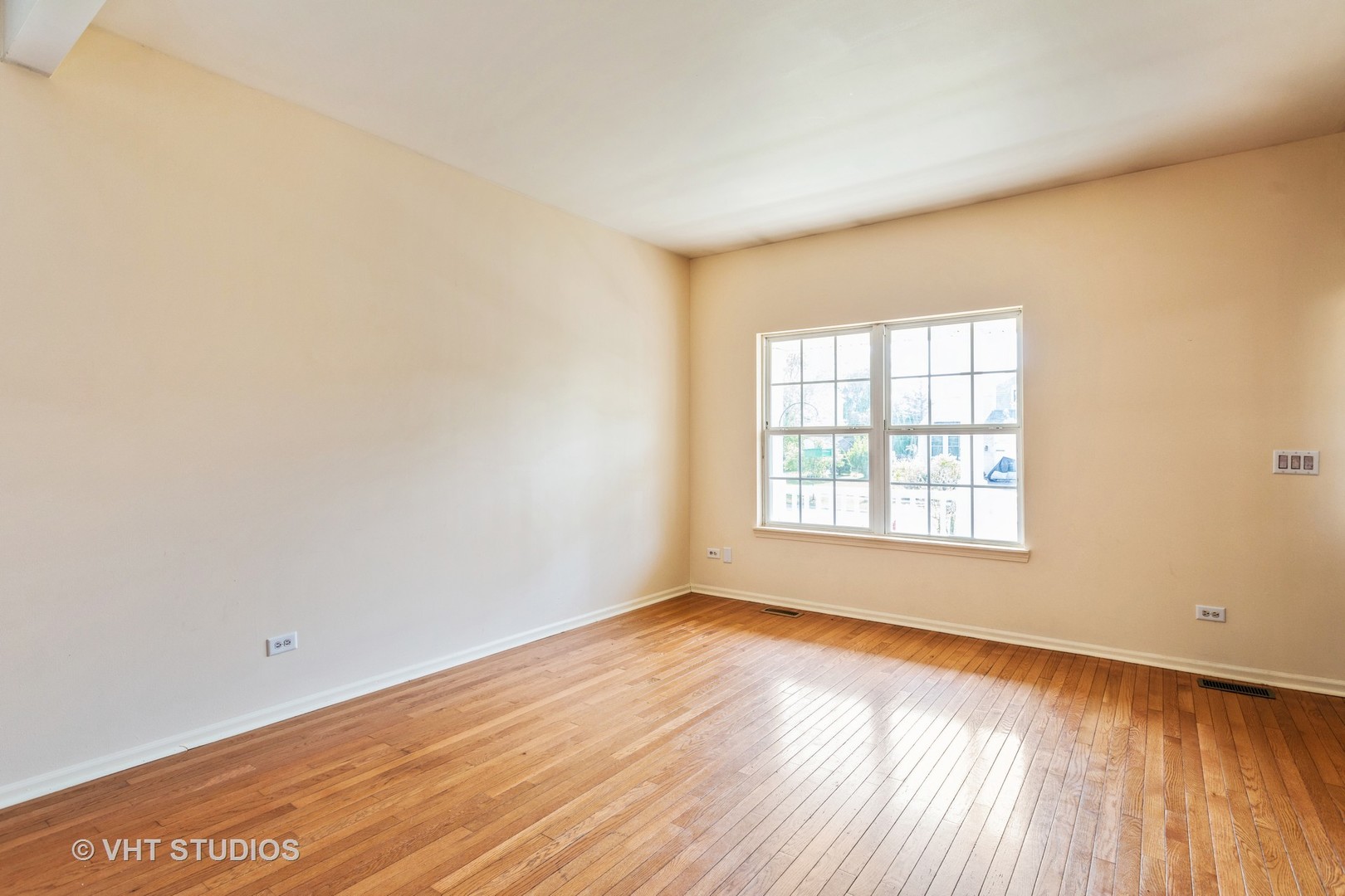 28494 Wagon Trail Road Lakemoor, IL 60051 - Photo 6 of 17 an empty room with wooden floor and windows