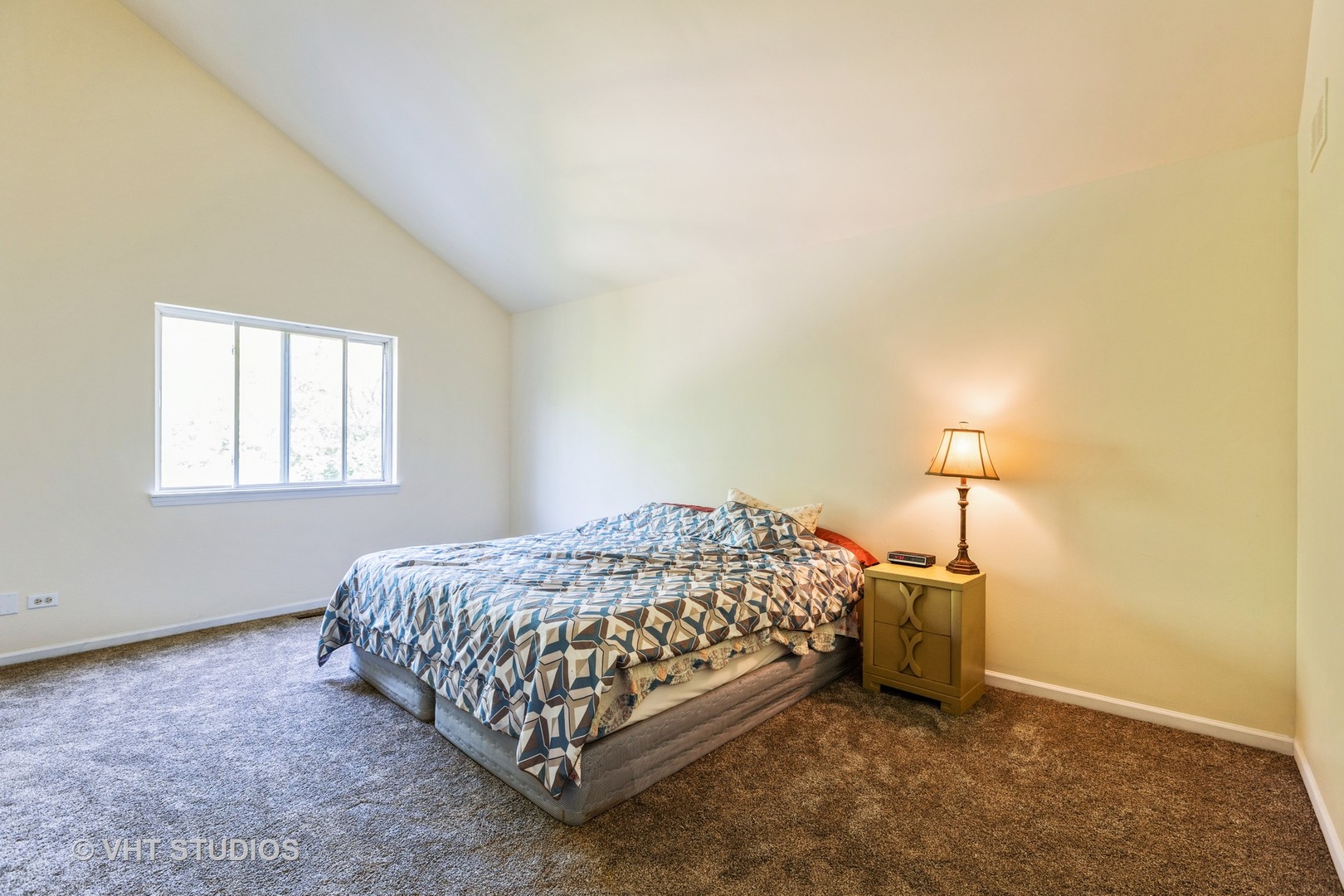 28494 Wagon Trail Road Lakemoor, IL 60051 - Photo 8 of 17 a bed sitting in a bedroom next to a window
