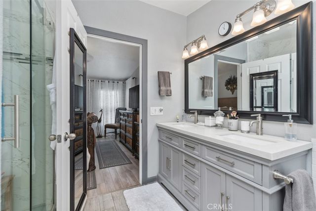 a bathroom with a double vanity sink and a mirror
