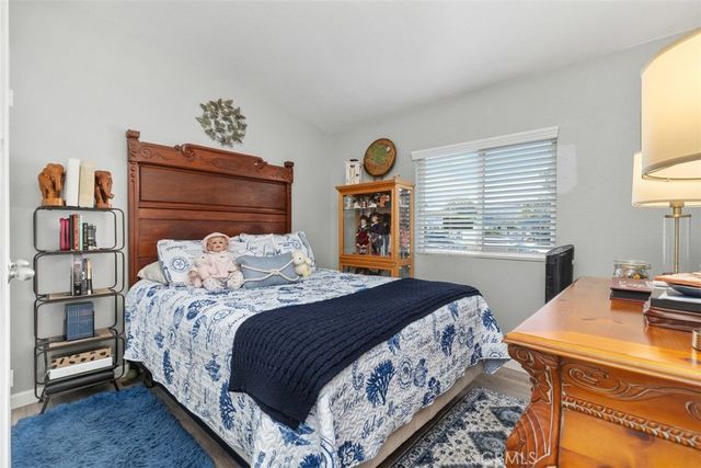 a bedroom with a bed and a table in it