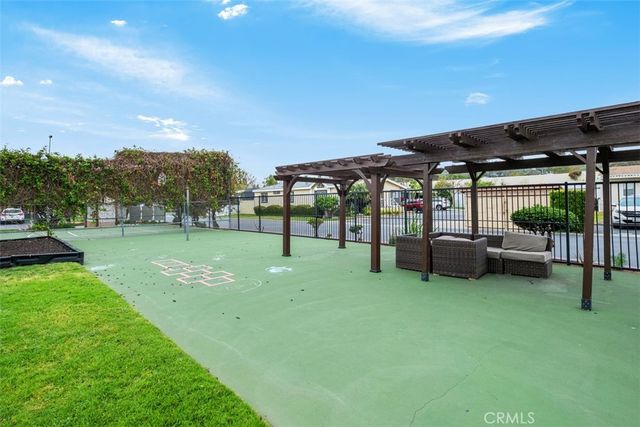 a view of a backyard with sitting area