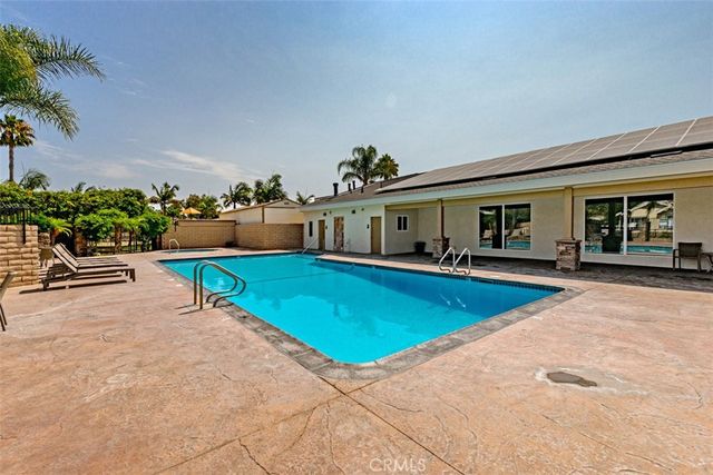a view of a house with swimming pool