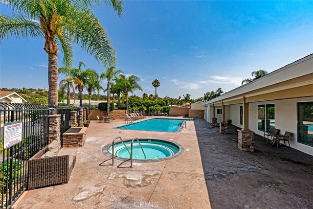a view of a swimming pool with a patio