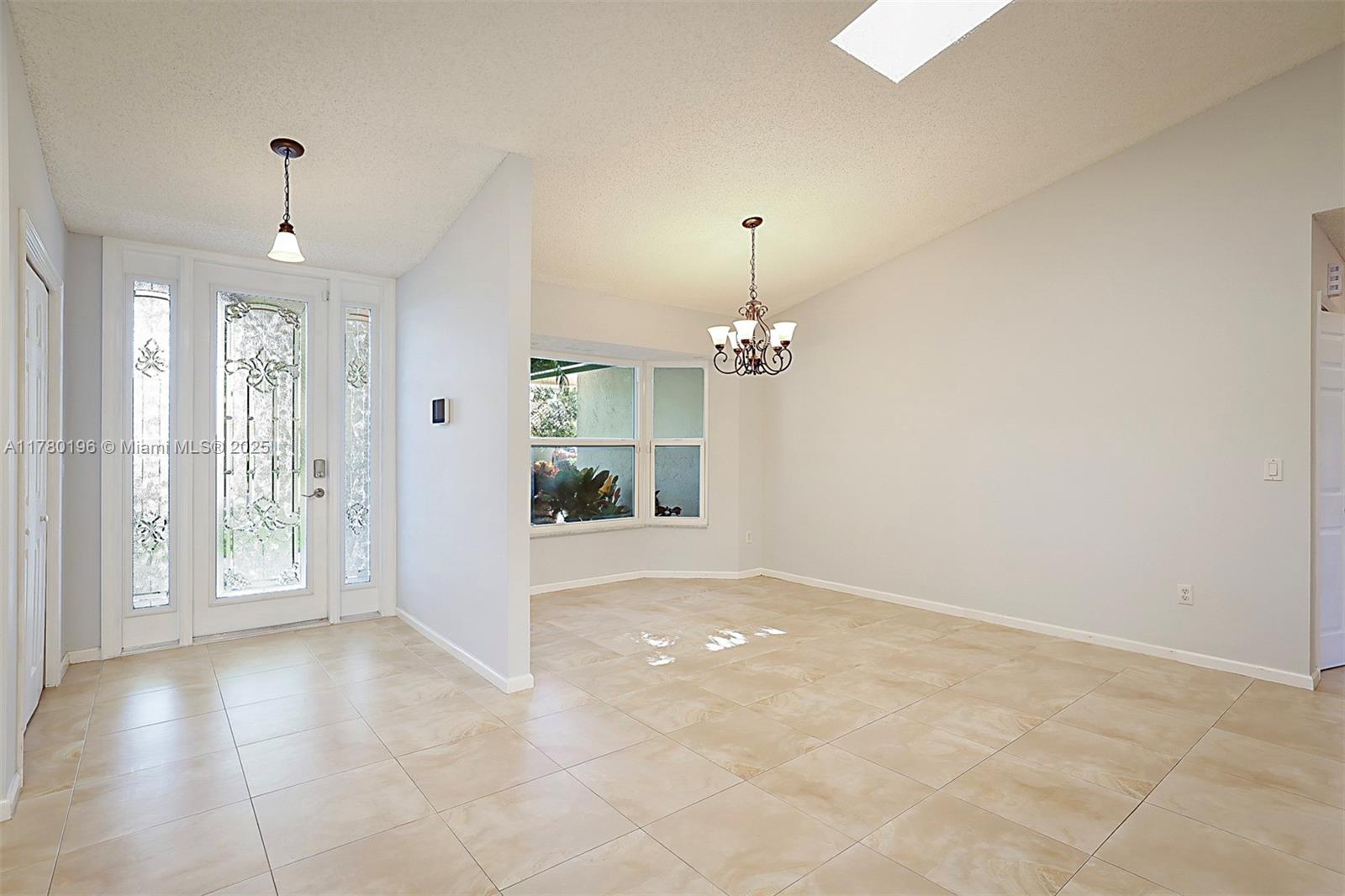 18295 Lake Bend Drive Jupiter, FL 33458 - Photo 11 of 64 a view of an empty room with a window
