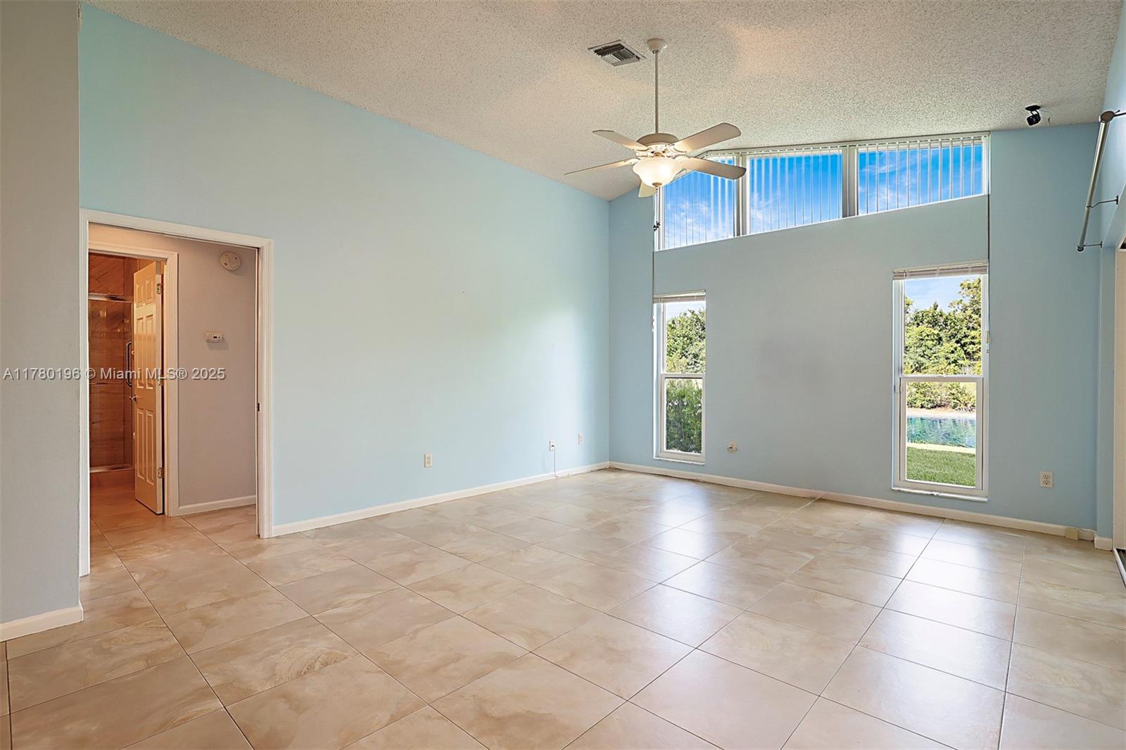 18295 Lake Bend Drive Jupiter, FL 33458 - Photo 21 of 64 a view of an empty room with a window