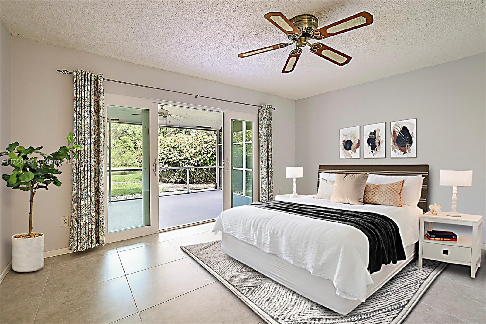 18295 Lake Bend Drive Jupiter, FL 33458 - Photo 24 of 64 a bedroom with a large bed and a potted plant