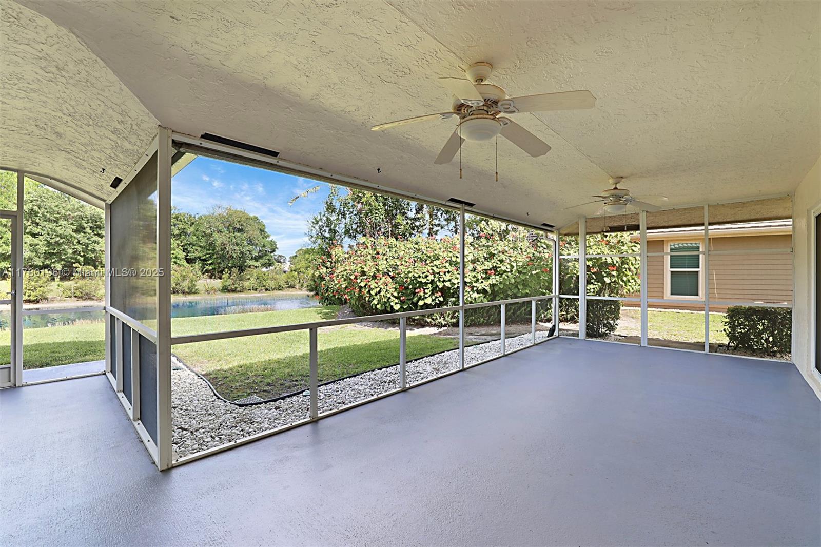 18295 Lake Bend Drive Jupiter, FL 33458 - Photo 37 of 64 a view of a room with porch and wooden floor