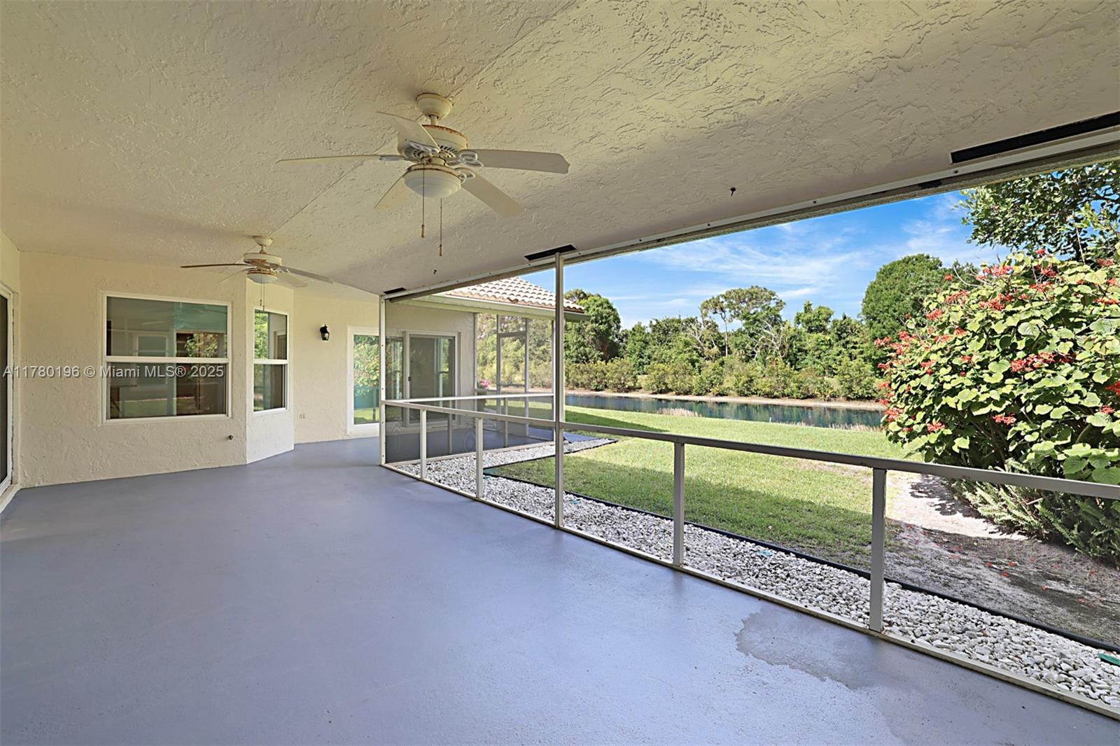 18295 Lake Bend Drive Jupiter, FL 33458 - Photo 38 of 64 a view of a porch and garden
