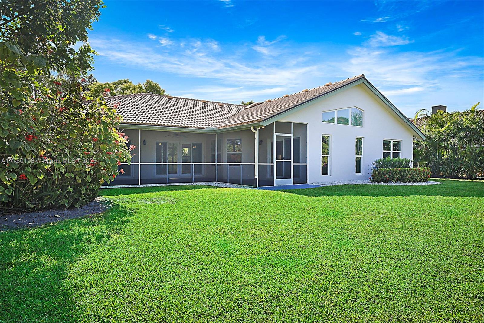 18295 Lake Bend Drive Jupiter, FL 33458 - Photo 41 of 64 a view of a house with a backyard