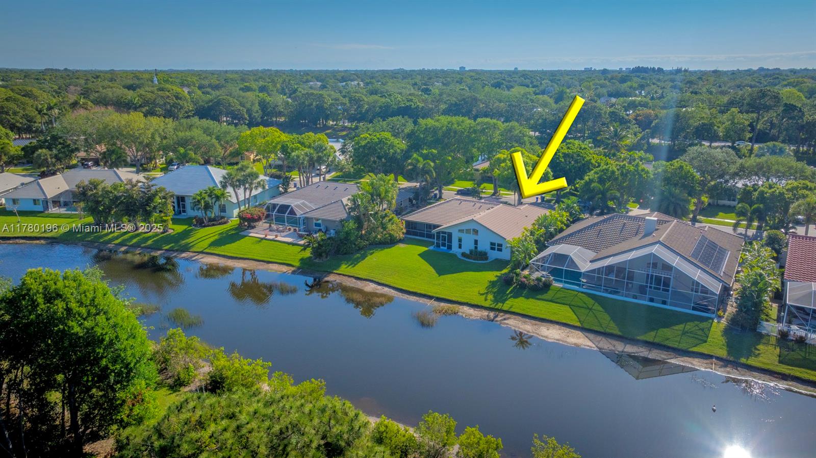 18295 Lake Bend Drive Jupiter, FL 33458 - Photo 54 of 64 an aerial view of a house with a garden and lake view