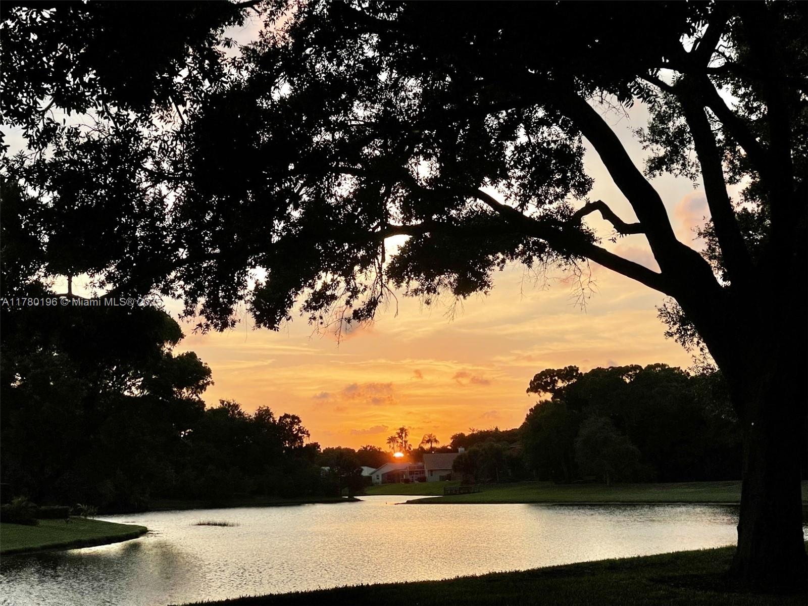18295 Lake Bend Drive Jupiter, FL 33458 - Photo 64 of 64 a view of sunset