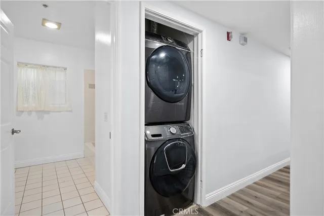 a view of a hallway with washer and dryer