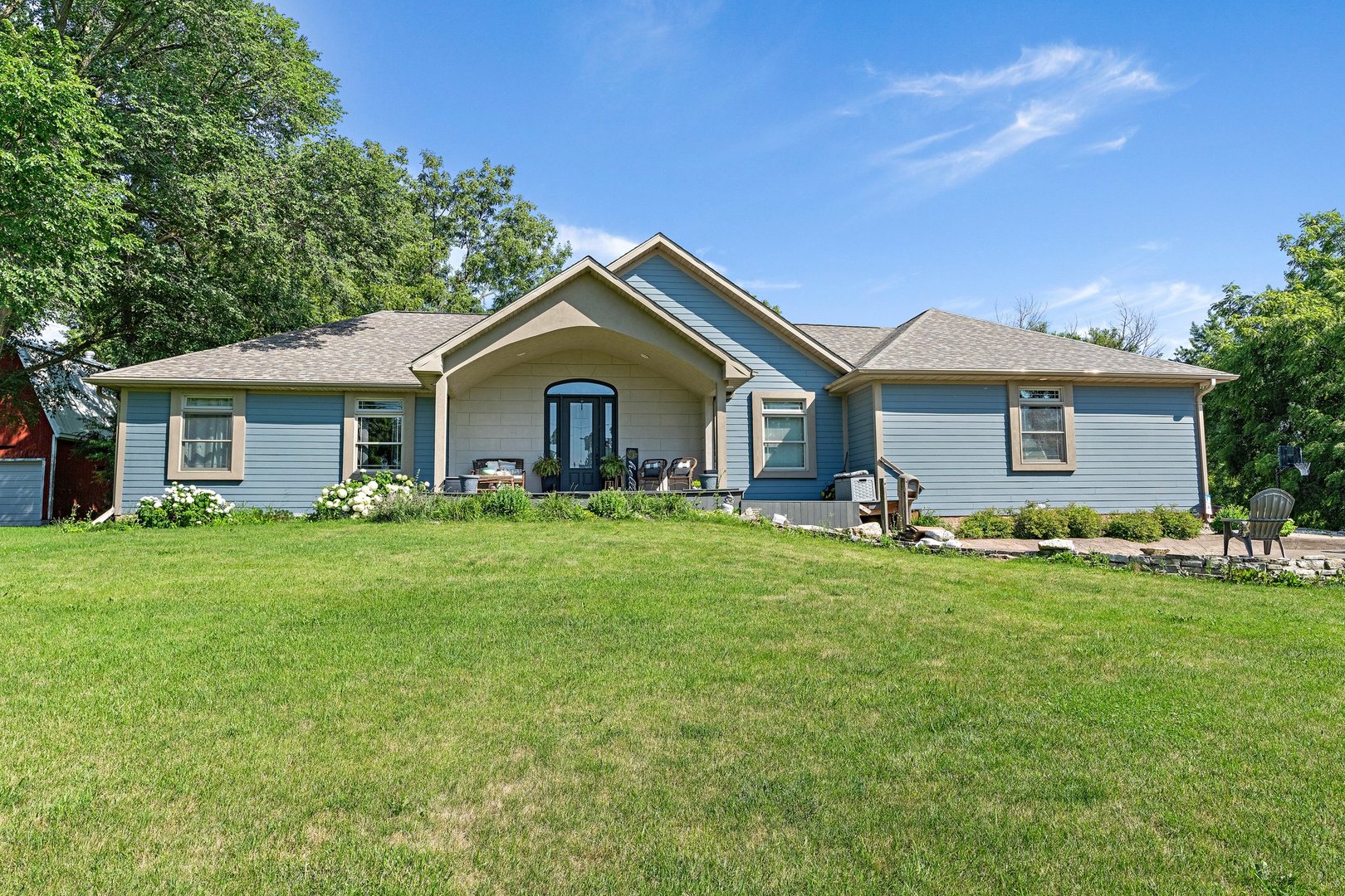 1212 Sycamore Road DeKalb, IL 60115 - Photo 1 of 44 a front view of a house with a garden