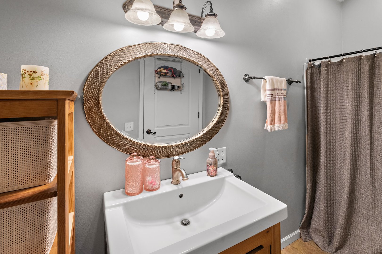 1212 Sycamore Road DeKalb, IL 60115 - Photo 17 of 44 a bathroom with a sink and a mirror