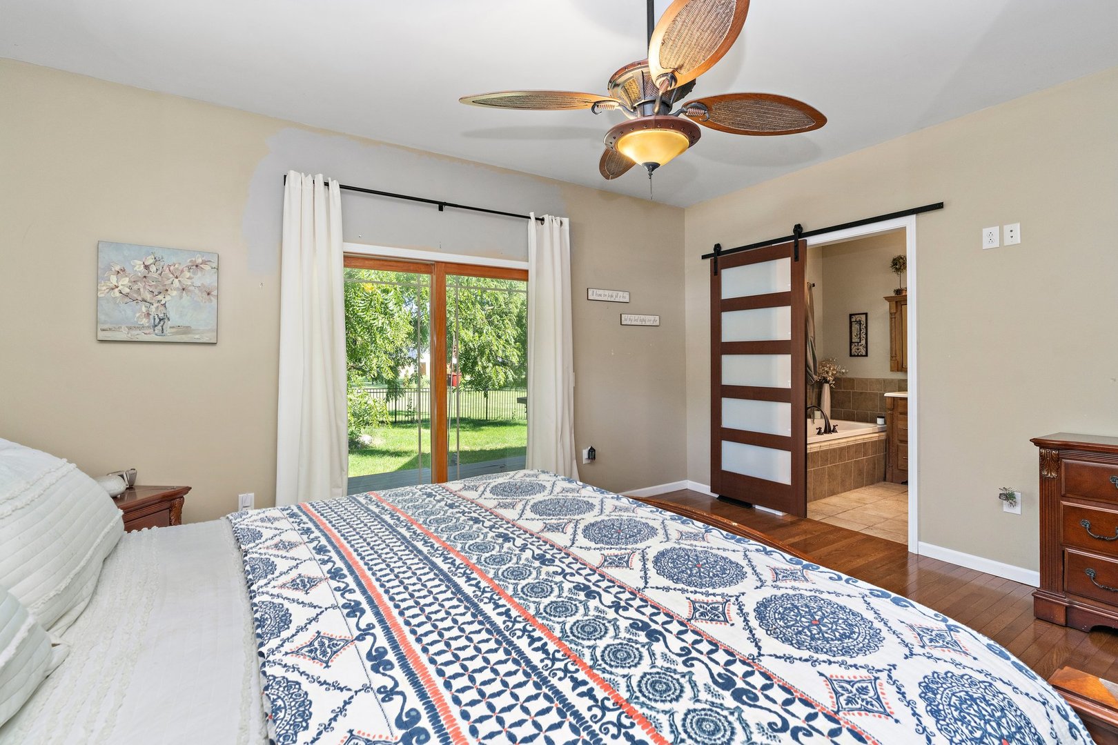 1212 Sycamore Road DeKalb, IL 60115 - Photo 21 of 44 a bedroom with a bed and a chandelier