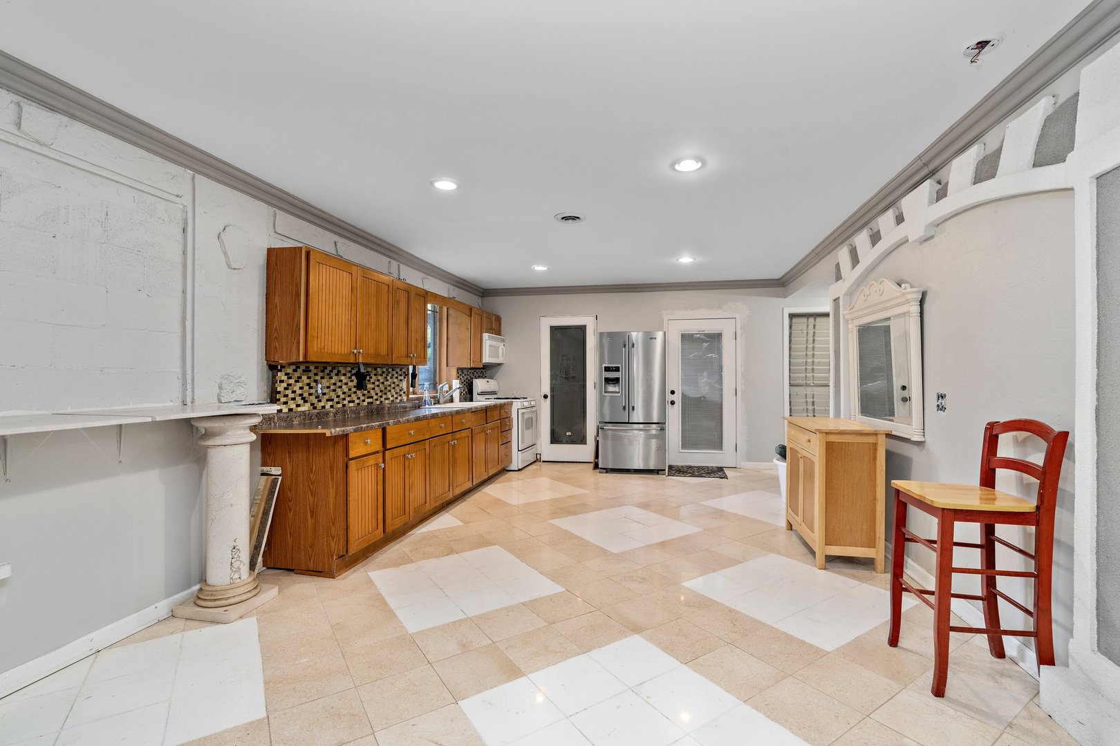 1212 Sycamore Road DeKalb, IL 60115 - Photo 25 of 44 a large kitchen with a table and chairs