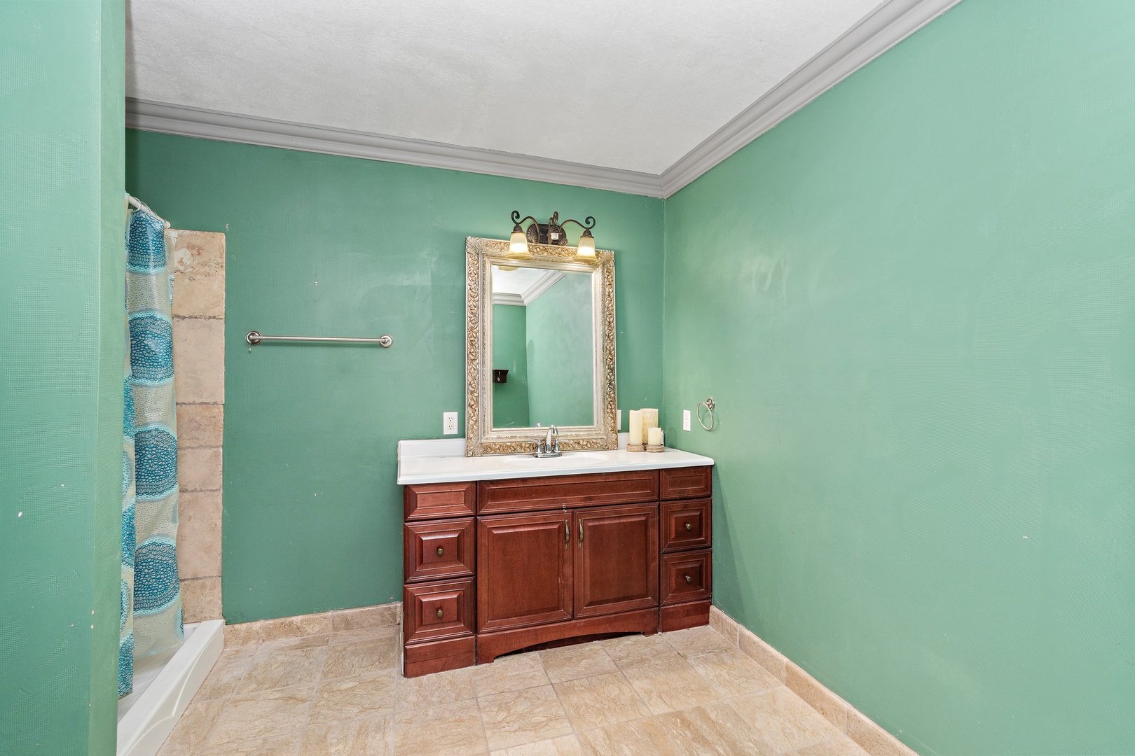 1212 Sycamore Road DeKalb, IL 60115 - Photo 27 of 44 a view of a bathroom with a sink and a mirror