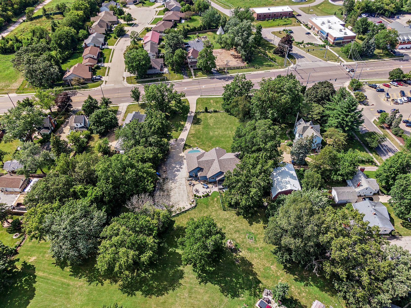 1212 Sycamore Road DeKalb, IL 60115 - Photo 41 of 44 an aerial view of residential house with outdoor space and trees all around