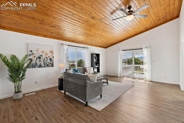 10925 Double D Road Fountain, CO 80817 - Photo 13 of 33 Living area featuring wood ceiling, wood finished floors, ceiling fan, and high vaulted ceiling