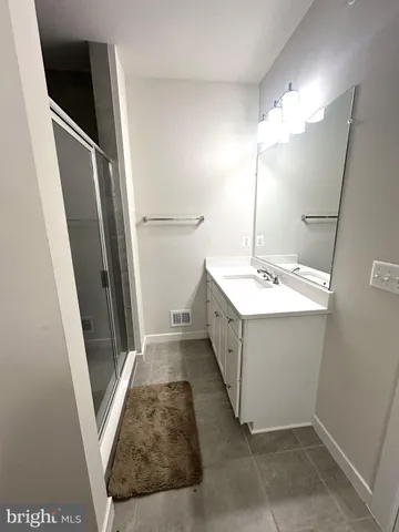 a bathroom with a sink a mirror and a toilet