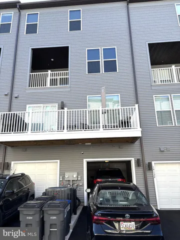 a view of front door of house with stairs