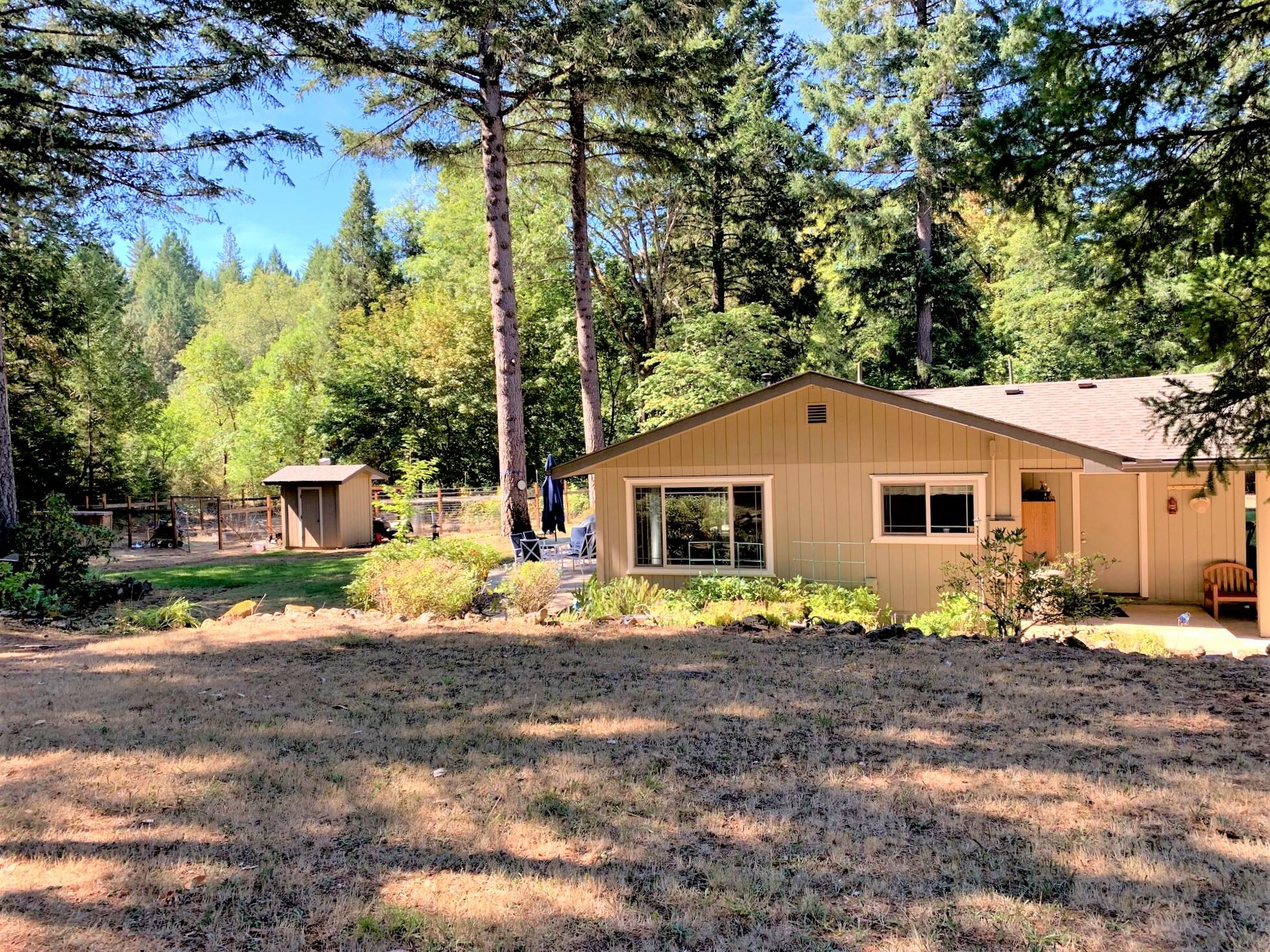 2793 Pleasant Creek Road Rogue River, OR 97537 - Photo 24 of 39 View from orchard area looking toward the back yard and fenced garden
