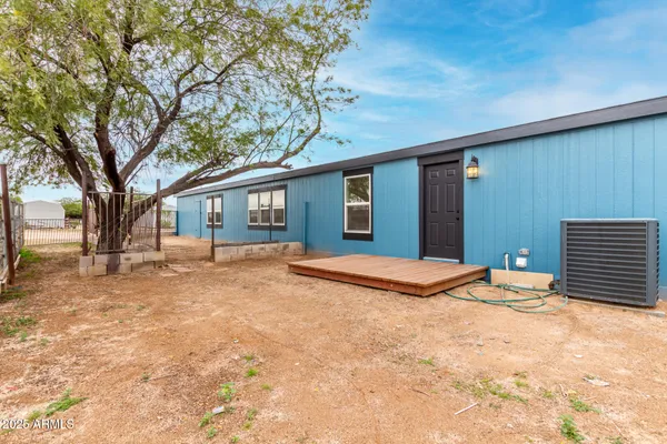 a view of backyard of a house