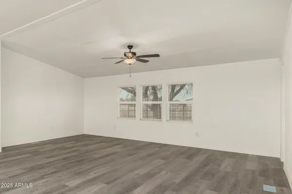 a view of a livingroom with wooden floor